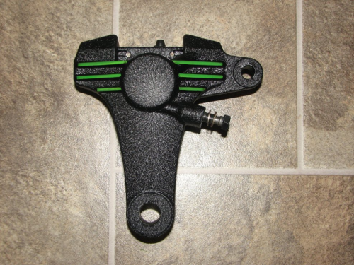 Wrinkle black brake caliper with candy lime green stripes over polished aluminum